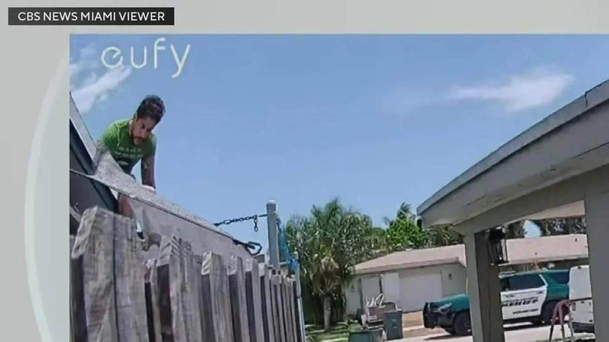 Surveillance video captured a man identified by police as Abraham Recinos sitting on a roof, apparently unnoticed by Broward deputies passing by, lower right. Surveillance video captured a man identified by police as Abraham Recinos sitting on a roof, apparently unnoticed by Broward deputies passing by, lower right.
